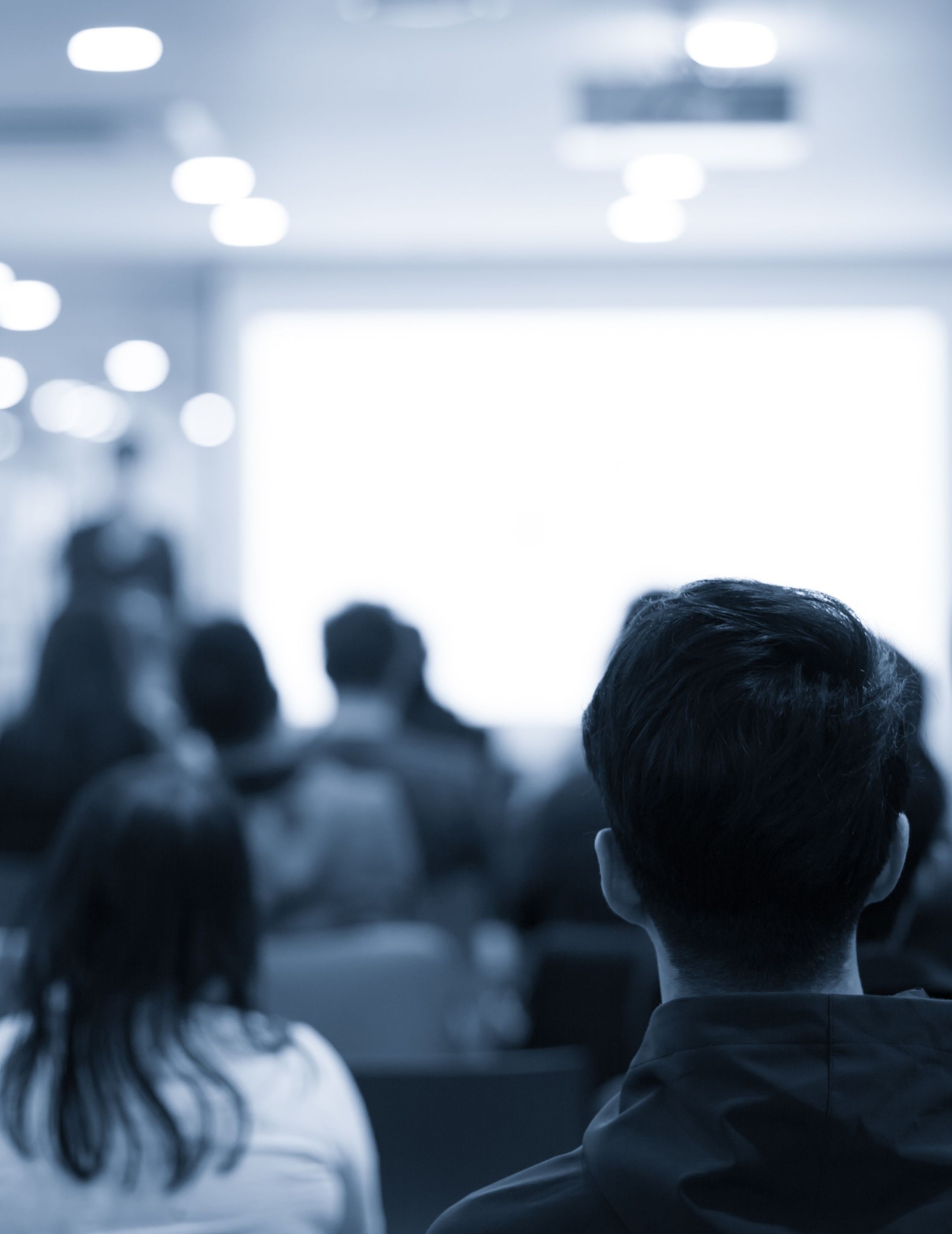 Conference photo audience and speaker giving speech. Seminar presenter at CEO forum. Real estate expert in training lecture. Investor pitch presentation workshop picture.